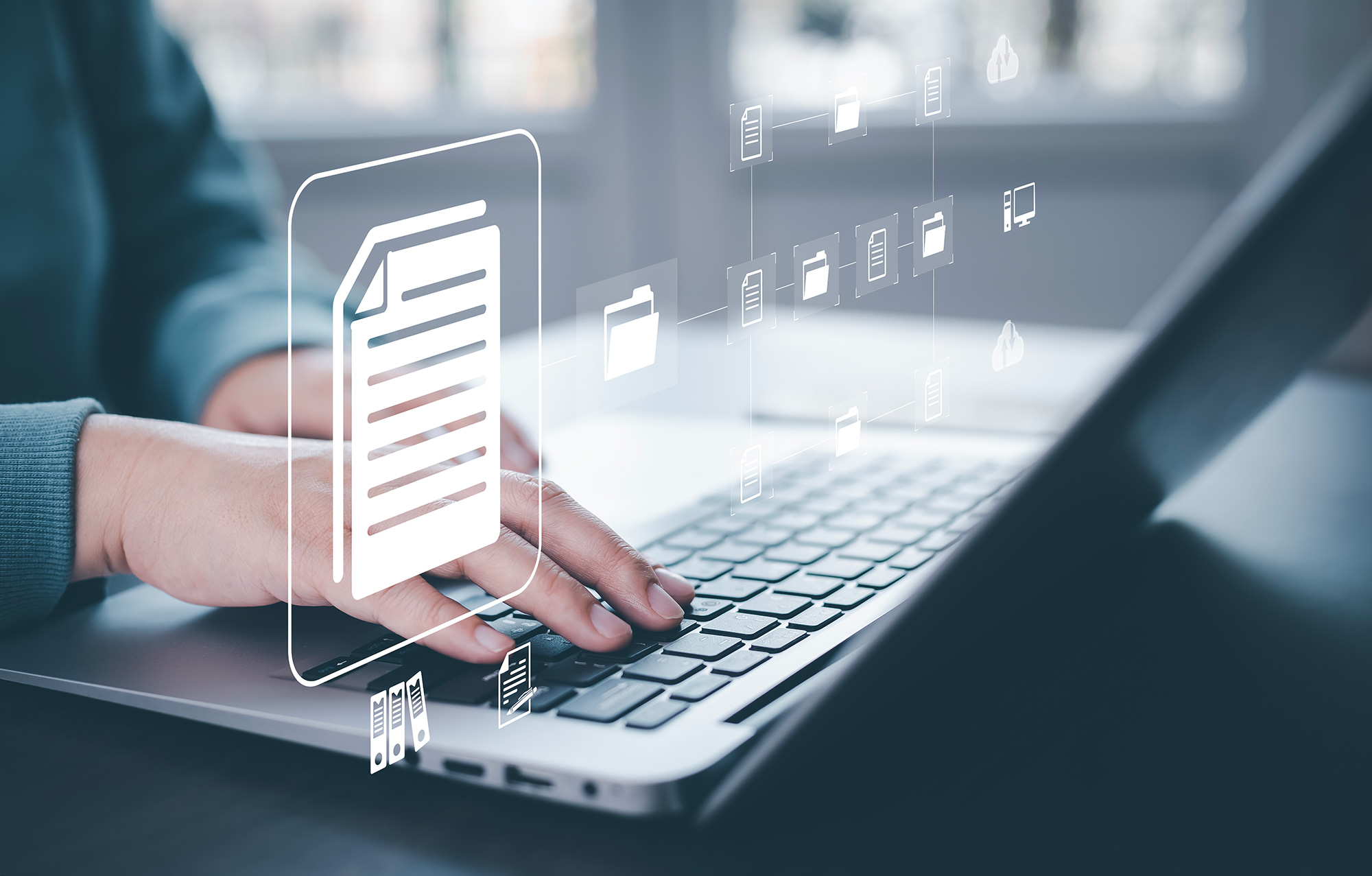 Person typing on laptop with digital file and folder icons overlaid—representing automated document handling and compliance record generation in enterprise systems.