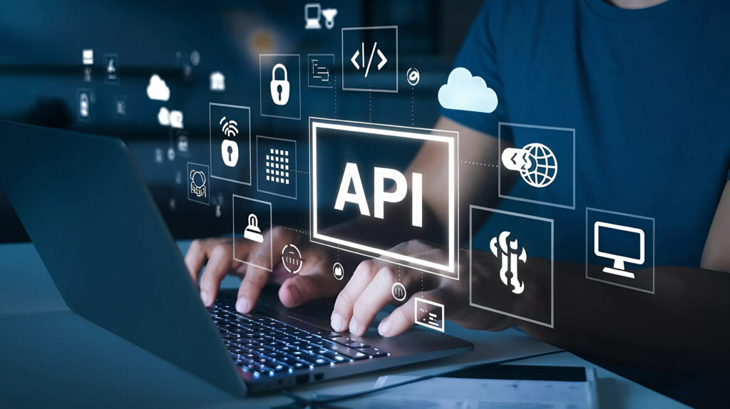 Hands typing on a laptop with digital icons representing API integration, cloud computing, security, and data exchange.