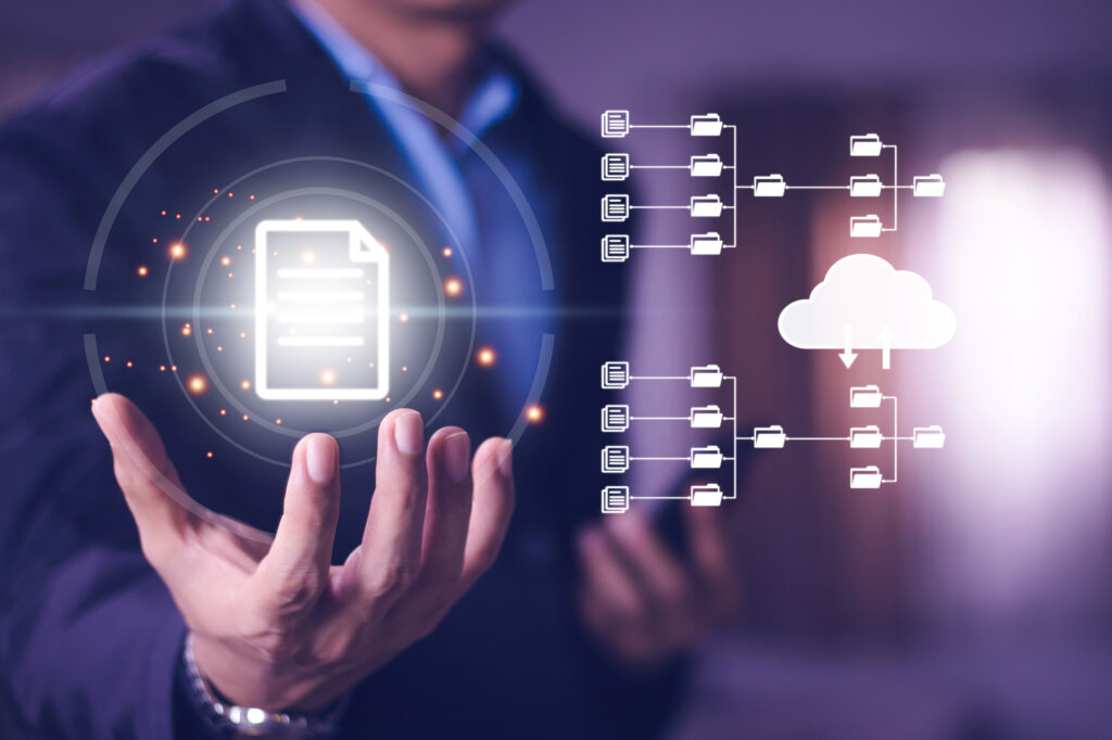 Business professional holding a digital document icon with connected folders and cloud storage, symbolizing ChatGPT data migration planning.