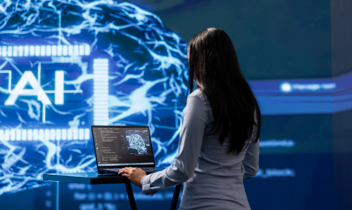 Consultant reviewing AI system architecture on a laptop with a neural network display in the background