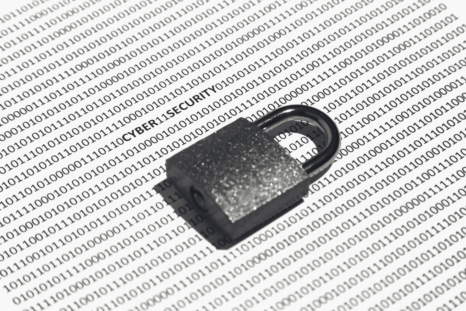 Padlock placed on binary code illustrating cybersecurity, data privacy, and protection of digital systems.